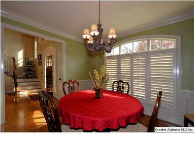 Formal dining room; plantation shutters throughout