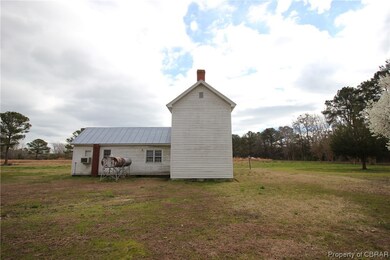 View of shed / structure with a lawn