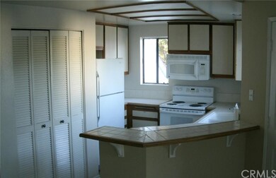 Kitchen Area. Refrigerator, Stove, M/W.  Closet Co