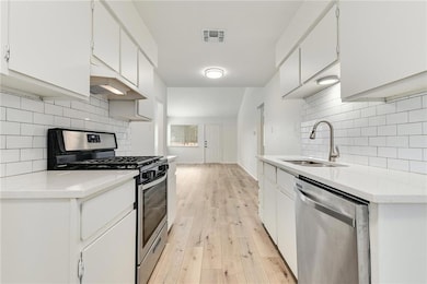 Kitchen with stainless steel appliances, under ca