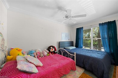 Bedroom featuring parquet floors, ornamental moldi
