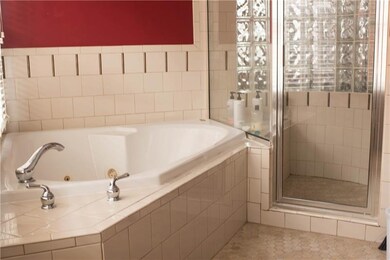 Master bath with Jacuzzi tub and walk-in shower