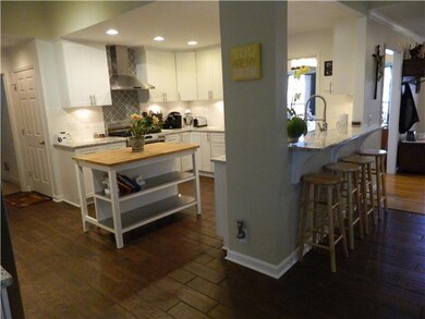 Quiet close doors and drawers.  Island can stay.