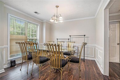 Dining space featuring wood finished floors, a cha
