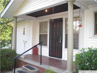 The side porch is equally as welcoming!