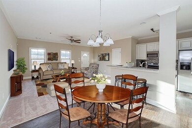 Dining area with wood finished floors, baseboards,