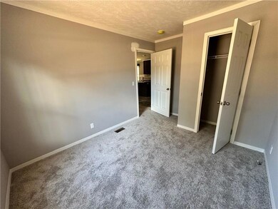 Unfurnished bedroom with a closet, carpet floors, 