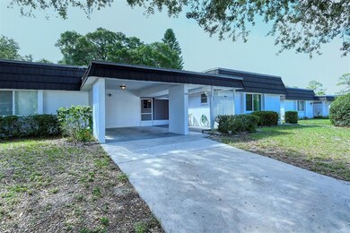 Carport, driveway and Paver brick patio 