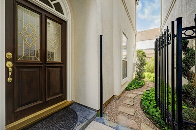 At front door area, gate opens to landscaped patio.