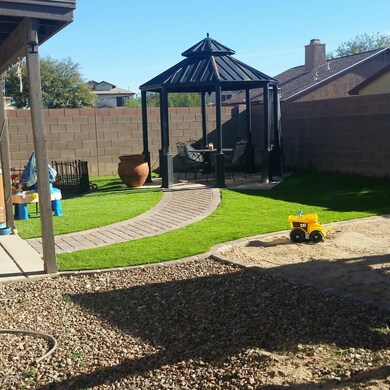 Backyard landscaped with gazebo