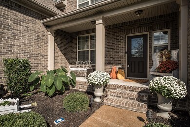 This front porch is so cozy! Notice the Ring Video Doorbell that’s installed. https://ring.com/videodoorbells