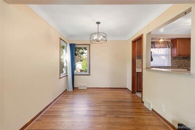 Unfurnished dining area with a chandelier and light wood-style flooring