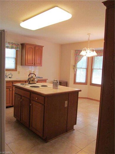 Kitchen with ceramic flooring.