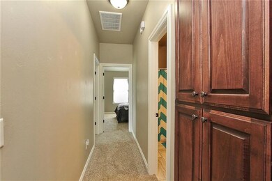 Arched Hallway with Storage to 2 Bedrooms and Bath