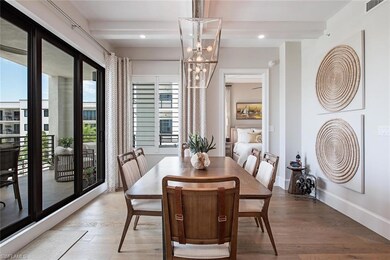 Dining area with beam ceiling, a chandelier, and  