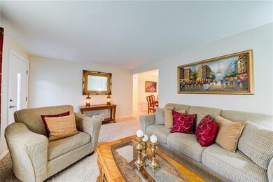 Plenty of seating available in the formal living r