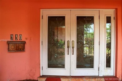 Front courtyard entrance with double glass doors