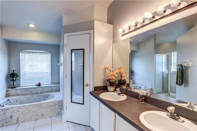 Master bath with dual sinks and garden tub