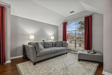 Large front living area with natural light flowing through.