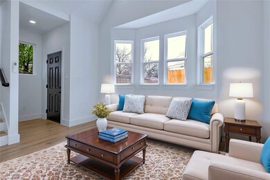 Living area with stairs, baseboards, a wealth of 
