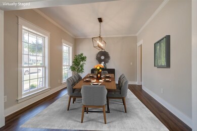 Formal Dining Room at the front of home. New light