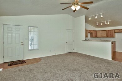 Vaulted Ceiling Lends An Airy Feel To Open Concept