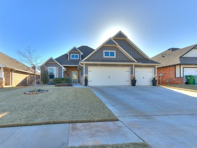 Craftsman inspired home featuring a garage, roof with shingles, board and batten siding, and driveway