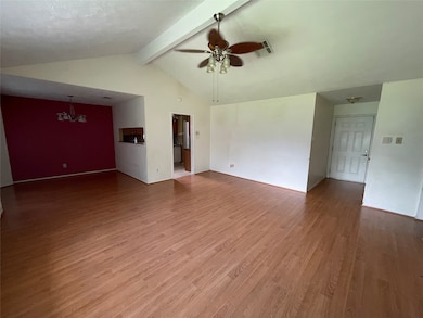 Large living room with plenty of natural light.