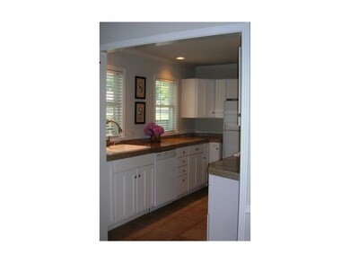 Updated Kitchen features Tile Floors, Granite Coun