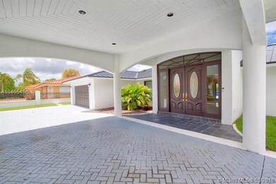 Porte cochere and pavered driveway. Pull cars up r