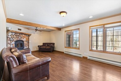 Living room comfort with wood flooring, wood burni