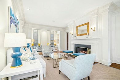The gracious and spacious living room with firepla