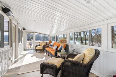 Sunroom with rear entrance to deck.