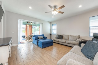 Living room with triple sliders to outdoor living space
