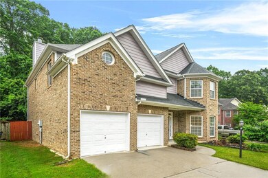 View of front of property with concrete driveway, 