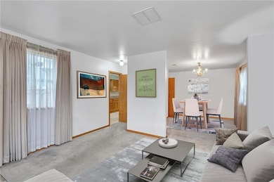 Great space for entertaining family and friends. Living Room, Dining Room and Kitchen greet you as you enter. Staged.