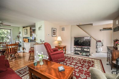 Wide Open view of both Kitchen and Living Room.