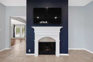 Accent wall with fireplace creates a cozy focal po