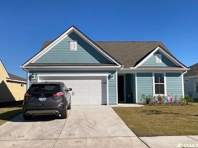 View of front facade featuring a garage and a fron