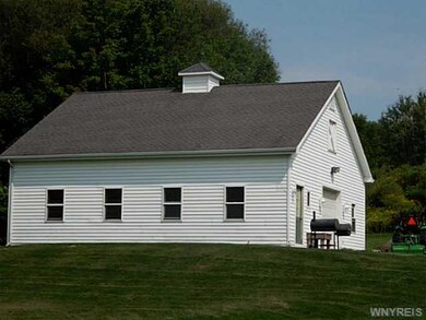 Barn. Two story barn with 3+ stalls, electric, wat