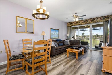 Living room with ceiling fan with notable chandeli