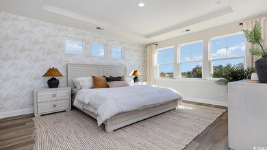 Bedroom with dark hardwood / wood-style flooring, 