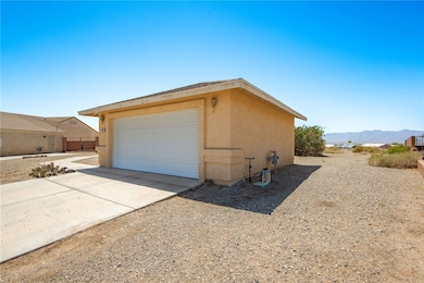 Garage with a mountain view and driveway