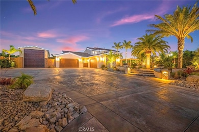 Expansive custom driveway:
A grand, custom-stamped concrete driveway offers a striking first impression, combining elegant design with exceptional craftsmanship. Its expansive layout provides ample parking and complements the home’s impressive curb 