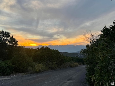 View of dirt / gravel road with a mountain view