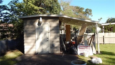 Storage shed with a dog kennel or area to keep you