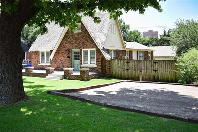 Rear view of property featuring a yard