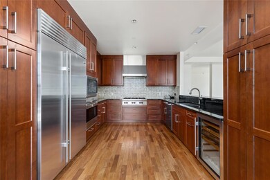 Kitchen featuring wine cooler, stainless steel ap