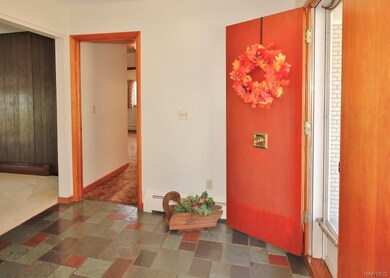OPENS TO LARGE ENTRANCE FOYER WITH SLATE FLOOR