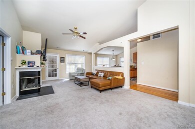 Den with view of entry to Primary Bedroom, sunroom